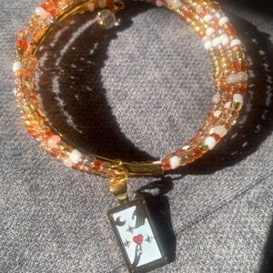 Gold and Orange Beaded Bracelet with Pendant